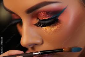 up shot of a makeup artist applying a