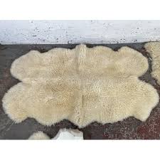 three sheepskin rugs to include dunelm