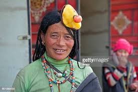 Portrait of Tibetan Khampa woman wearing traditional amber and red... News  Photo - Getty Images
