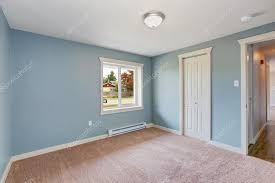 light blue bedroom with closets stock