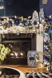 christmas mantel with a tv above