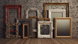 many antique wooden frames in diffe