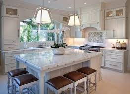Real simpleâ rolling kitchen island in white rolling kitchen from white kitchen carts and islands, image by:pinterest.com stainless steel stove hood tags kitchen island range kitchen from white. A White Kitchen Featuring White Cabinetry And Kitchen Counters Along With Custom Kitchen Island Traditional Kitchen Island Traditional Kitchen Island Lighting