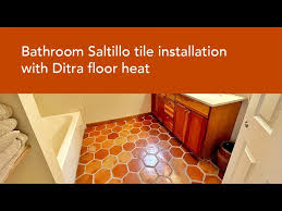 saltillo tile in heated floor bathroom