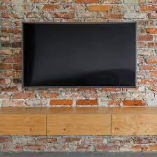 Flat Screen Tv On A Brick Wall