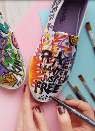 If splattering paint is a bit too daunting for you, you can always paint directly on the shoes like making hash marks with a flat foam brush. Diy Fabric Shoe Design Painting Shoes Has Never Been Easier To Do That With Acrylic Paint Pens To Help Craft Yo Diy Fabric Shoes Painted Shoes Fabric Painting