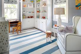 white and blue boy nursery with l