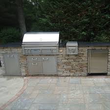 outdoor kitchen with a stacked stone