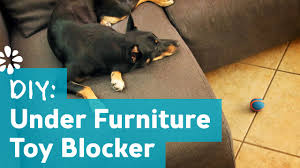 diy under furniture pet toy blocker