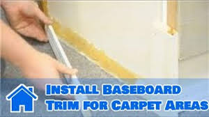 install baseboard trim for carpet areas