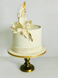 Display your cake in style with a great gatsby wedding cake stand from zazzle. White And Gold Great Gatsby Inspired Cake Perfect For Weddings Bridal Shower Or Birthday Decorated With Beautiful Sugar Flowers Pearls And Feathers Ottawa Custom Cakes Wedding Cakes Event Catering