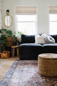 small cozy living room with black sofa