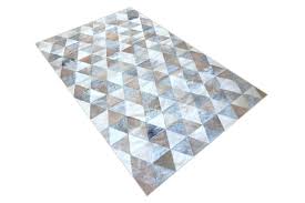 white grey and beige triangle cowhide rug