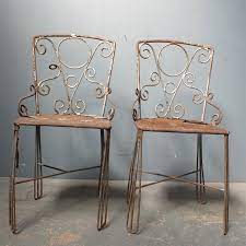 pair of decorative metal garden chairs
