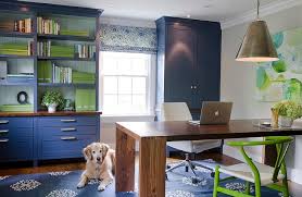 A colorful and fun girlish home office with a comfy desk, a bright gallery wall, a basket with pillows and a fur rug. Yellow And Blue Office Design Ideas