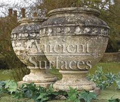 antique stone planters and pedestals by