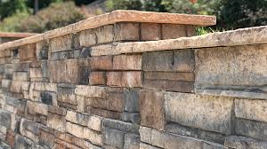 The average cost to build a retaining wall is between $3,500 to $10,000, with the average homeowner paying about $5,463 for a concrete block retaining wall that is 25 feet long and 4 feet. Heritage Block The Most Attractive Retaining Wall Block In The World