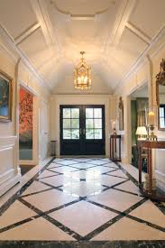 Elegant Paneled Entrance With Custom Designed Marble Floor