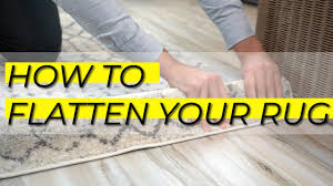 to flatten area rugs and remove dents