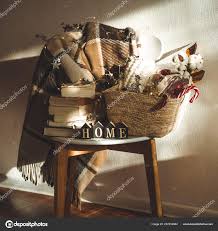 Winter Warm Blanket On A Chair With A Basket Of Christmas