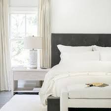 Brass Feet On Gray Upholstered Bed