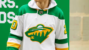 The logo depicts both a forest landscape and the silhouette of a wild animal. Check Out The North Stars Inspired Wild Alternate Jerseys