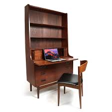 A hinged flat top opens to a hidden compartment and a luxe wooden interior. Borge Mogensen Danish Teak Secretary Desk With Bookcase Hutch