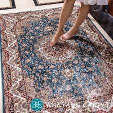 small handmade blue silk persian rug