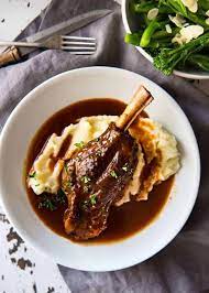 These wine braised lamb shanks are so deliciously tender, they melt right off the bone. Port Braised Lamb Shanks Recipetin Eats