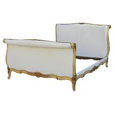 antique daybed with gold roll top for