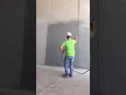 spraying cement paint for concrete