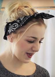 A bun is a type of hairstyle in which the hair is pulled back from the face, twisted or plaited, and wrapped in a circular coil around itself, typically on top or back of the head or just above the neck. Chloe Lukasiak Straight Honey Blonde Bun Dark Roots Face Framing Pieces Headband Messy Bun Hairstyle Steal Her Style