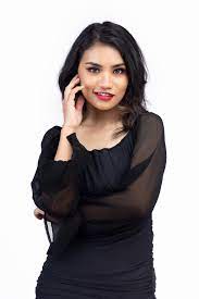 Attractive Sexy Nepali woman in black dress posing in studio - Photos Nepal