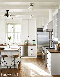 Farmhouse kitchen with shaker style cabinets painted in sherwin williams snowbound. 12 White Kitchen Cabinets Black Hinges And Hardware Ideas White Kitchen Cabinets New Kitchen Kitchen Design
