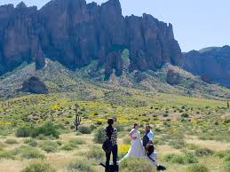 andrew lichtenstein corbis via getty imagesa couple poses for wedding photographs in the sonoran desert s supersion mounns at the lost dutchman state