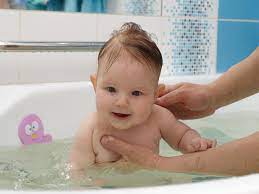 Simply so, how do you bathe a newborn after circumcision? How Often To Bathe A Newborn According To Pediatricians