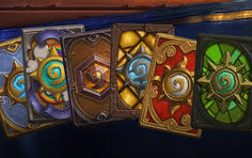 Top view of a wild card from a deck of playing cards on a pile of scattered cards with a red back. Card Back Hearthstone Wiki