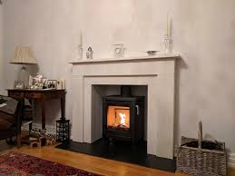 Limestone Fireplace With A Log Burner