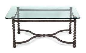 a wrought iron glass top coffee table
