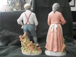 elderly couple figurines peaceful