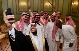 saudi groom basil albani poses for a selfie with his friends during his wedding at his