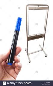 Blue Flip Chart Pen Held Up In Front Of A Flip Chart