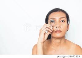 asian woman with makeup routine