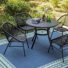 Round Metal Table And Wicker Chairs
