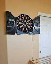 put behind a dart board to protect wall