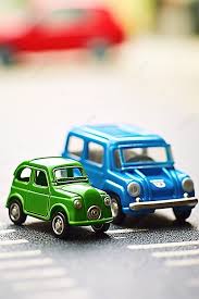 pair of mini toy cars and bikes