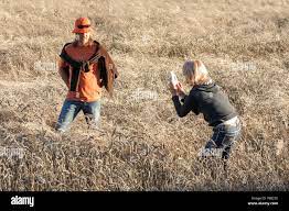 Amateur woman photographer shoots pictures. Model in a field, Czech  Republic Stock Photo - Alamy
