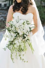 Flowers are classic wedding décor. Cascading Bridal Bouquet White Bridesmaids Bouquets How Much Does It Cost Chicago Style Weddings
