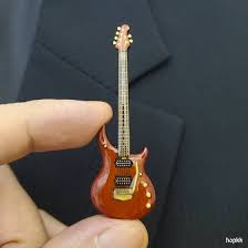 gold color guitar lapel pin