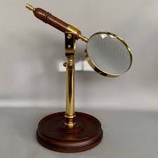 Brass And Wood Magnifying Glass On A